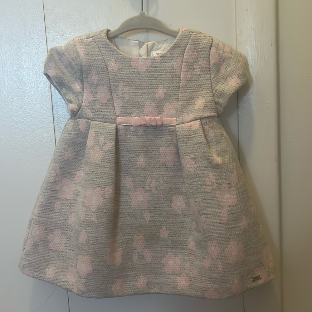 Adorable gray and pink dress for baby.